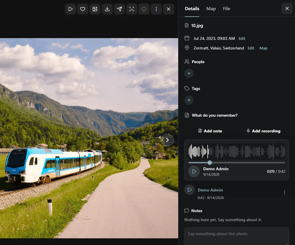 A photo of a train in an Alpine valley open in the viewer, with a 42-second voice recording under Recordings playing in a waveform player